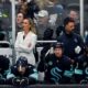 Seattle Kraken assistant coach Jessica Campbell, in white, looks on from the bench during the first period of an NHL hockey game against the St. Louis Blues, Tuesday, Oct. 8, 2024, in Seattle. (AP Photo/Lindsey Wasson)