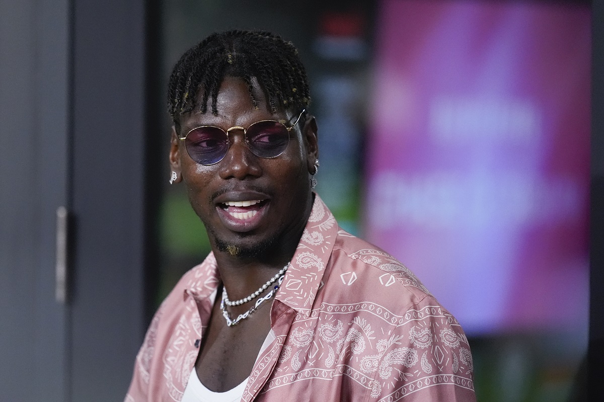 French professional soccer player Paul Pogba stands in a VIP suite at the start of an MLS soccer match between Inter Miami and Charlotte FC, Saturday, Sept. 28, 2024, in Fort Lauderdale, Fla. (AP Photo/Rebecca Blackwell)