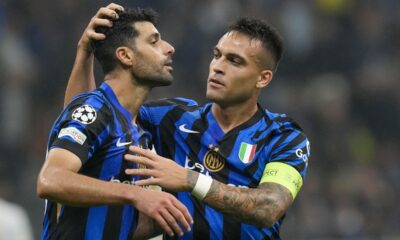 Inter Milan's Lautaro Martinez, right, celebrates with Inter Milan's Mehdi Taremi after scoring his side's third goal during the Champions League opening phase soccer match between Inter Milan and Red Star, at the San Siro stadium in Milan, Italy, Tuesday, Oct. 1, 2024. (AP Photo/Luca Bruno)