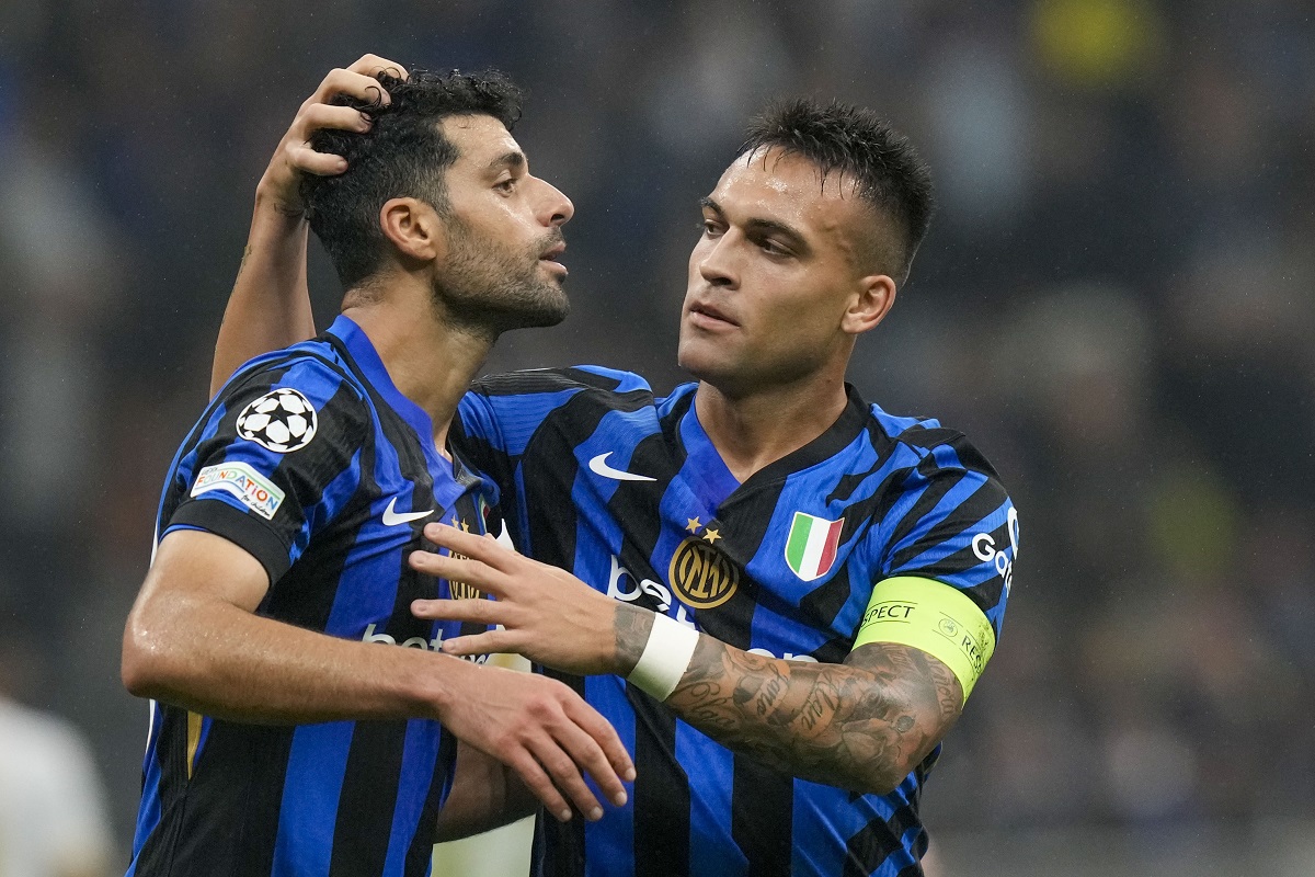 Inter Milan's Lautaro Martinez, right, celebrates with Inter Milan's Mehdi Taremi after scoring his side's third goal during the Champions League opening phase soccer match between Inter Milan and Red Star, at the San Siro stadium in Milan, Italy, Tuesday, Oct. 1, 2024. (AP Photo/Luca Bruno)