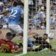 Napoli's Giovanni Di Lorenzo, centre, scores the opening goal during the Serie A soccer match between Napoli and Lecce at the Diego Armando Maradona Stadium in Naples, Italy, Saturday, Oct. 26, 2024. (Alessandro Garofalo/LaPresse via AP)