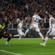 Roma's goalkeeper Mile Svilar, left, saves a shot by Inter Milan's Henrikh Mkhitaryan, centre, during the Serie A soccer match between Roma and Inter Milan at the Stadio Olimpico in Rome, Italy, Sunday, Oct. 20, 2024. (AP Photo/Andrew Medichini)