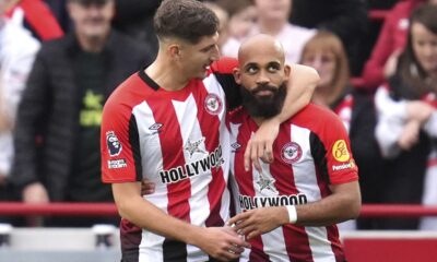 Brentford's Bryan Mbeumo, right, celebrates scoring his side's third goal of the game, during the English Premier League soccer match between Brentford and Ipswich Town, at the Gtech Community Stadium, in London, Saturday, Oct. 26, 2024. (John Walton/PA via AP)