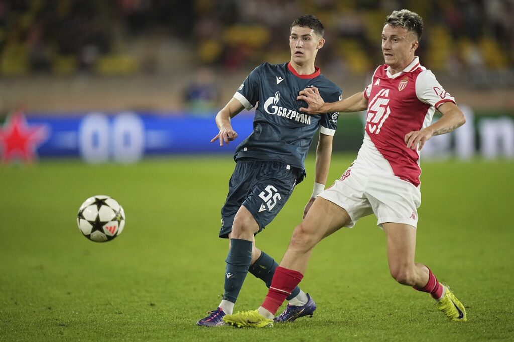 Monaco's Aleksandr Golovin, right, and Red Star's Andrija Maksimovic fight for the ball during the Champions League opening phase soccer match between Monaco and Crvena Zvezda, Red Star Belgrade, at the Louis II stadium, in Monaco, Tuesday, Oct. 22, 2024. (AP Photo/Laurent Cipriani)