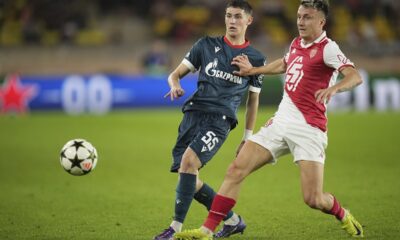 Monaco's Aleksandr Golovin, right, and Red Star's Andrija Maksimovic fight for the ball during the Champions League opening phase soccer match between Monaco and Crvena Zvezda, Red Star Belgrade, at the Louis II stadium, in Monaco, Tuesday, Oct. 22, 2024. (AP Photo/Laurent Cipriani)