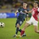 Monaco's Aleksandr Golovin, right, and Red Star's Andrija Maksimovic fight for the ball during the Champions League opening phase soccer match between Monaco and Crvena Zvezda, Red Star Belgrade, at the Louis II stadium, in Monaco, Tuesday, Oct. 22, 2024. (AP Photo/Laurent Cipriani)