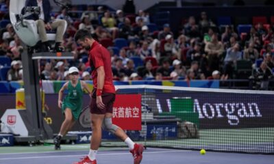 Novak Djokovic of Serbia reacts after failing to return a drop shot from Jannik Sinner of Italy during the men's singles match in the Shanghai Masters tennis tournament at Qizhong Forest Sports City Tennis Center in Shanghai, China, Sunday, Oct. 13, 2024. (AP Photo/Andy Wong)