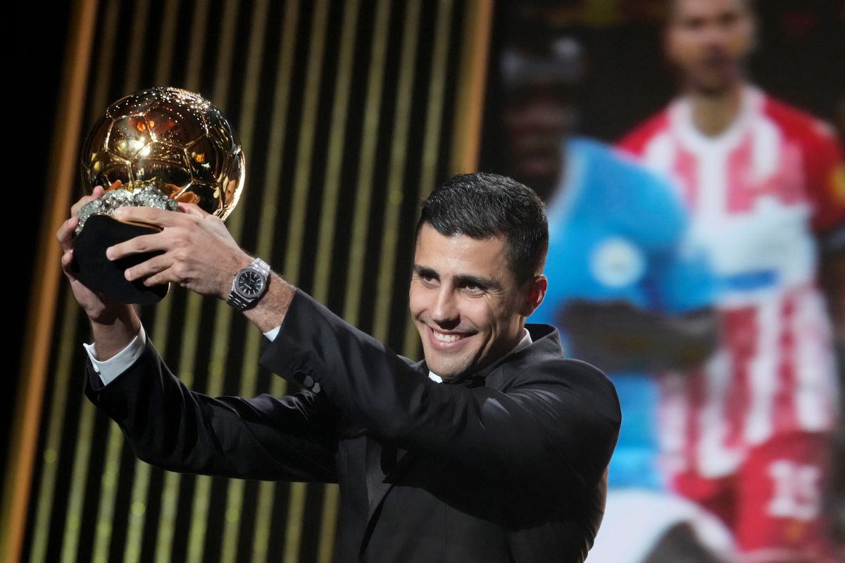 Manchester City's Spanish player Rodri receives the 2024 Men's Ballon d'Or award during the 68th Ballon d'Or (Golden Ball) award ceremony at Theatre du Chatelet in Paris, Monday, Oct. 28, 2024. (AP Photo/Michel Euler)