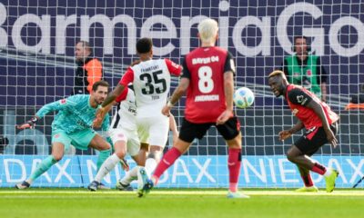 Leverkusen's Victor Boniface, right, fails to score during the German Bundesliga soccer match between Bayer Leverkusen and Eintracht Frankfurt at the BayArena in Leverkusen, Germany, Saturday, Oct. 19, 2024. (AP Photo/Martin Meissner)