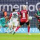 Leverkusen's Victor Boniface, right, fails to score during the German Bundesliga soccer match between Bayer Leverkusen and Eintracht Frankfurt at the BayArena in Leverkusen, Germany, Saturday, Oct. 19, 2024. (AP Photo/Martin Meissner)