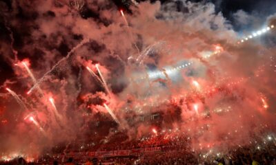 Fans of Argentina's River Plate launch fireworks before the start of a Copa Libertadores semifinal second leg soccer match against Brazil's Atletico Mineiro at Monumental stadium in Buenos Aires, Argentina, Tuesday, Oct. 29, 2024. (AP Photo/Gustavo Garello)