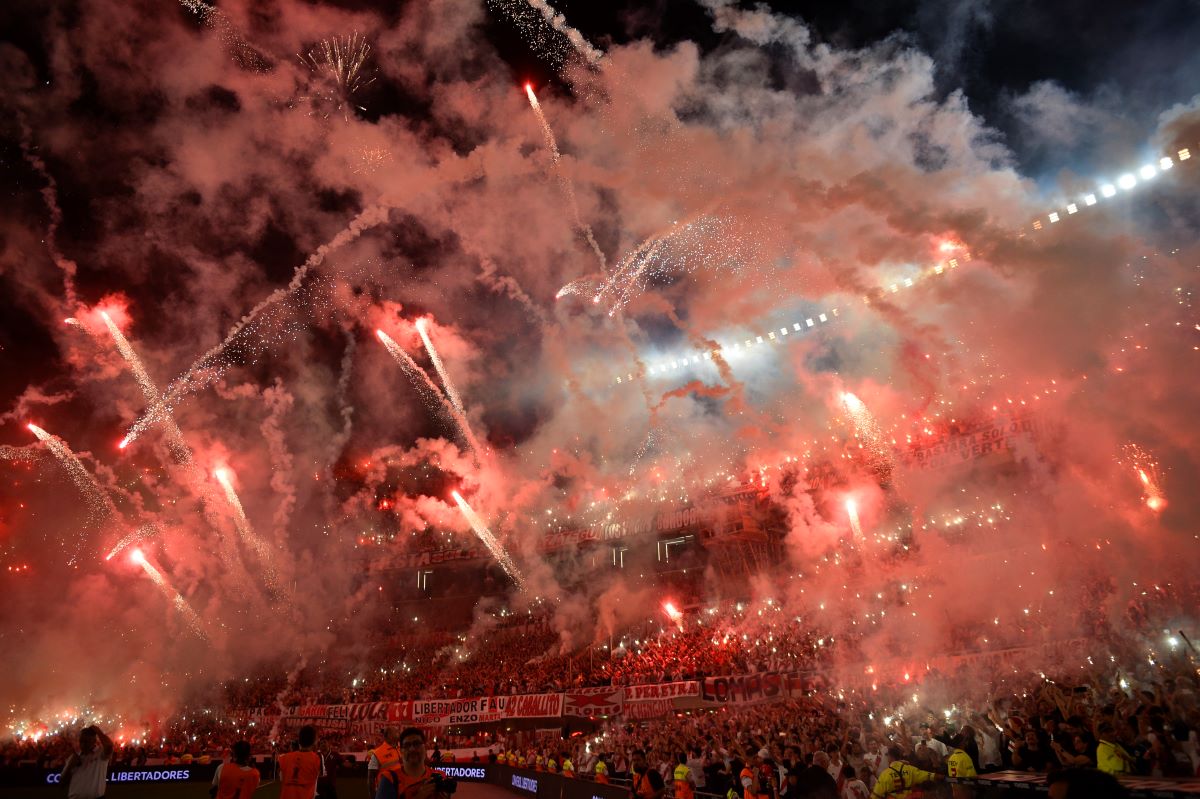 Fans of Argentina's River Plate launch fireworks before the start of a Copa Libertadores semifinal second leg soccer match against Brazil's Atletico Mineiro at Monumental stadium in Buenos Aires, Argentina, Tuesday, Oct. 29, 2024. (AP Photo/Gustavo Garello)