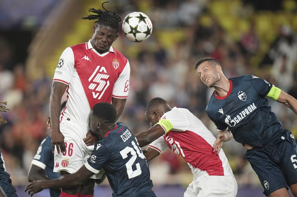 Monaco's Breel Embolo, right, and Red Star's Uros Spajic, right, jump for the ball during the Champions League opening phase soccer match between Monaco and Crvena Zvezda, Red Star Belgrade, at the Louis II stadium, in Monaco, Tuesday, Oct. 22, 2024. (AP Photo/Laurent Cipriani)