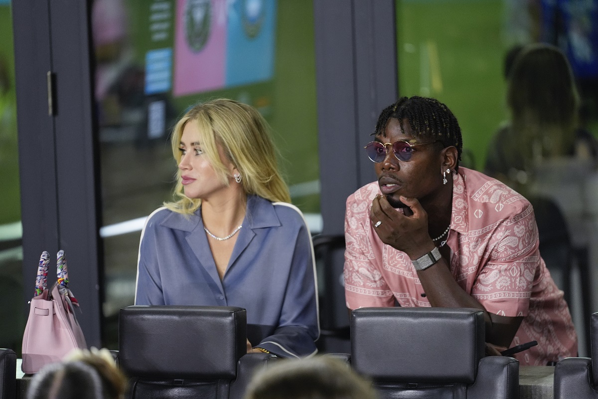 French professional soccer player Paul Pogba, right, watches from a VIP suite at the start of an MLS soccer match between Inter Miami and Charlotte FC, Saturday, Sept. 28, 2024, in Fort Lauderdale, Fla. (AP Photo/Rebecca Blackwell)