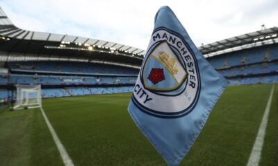 FILE - The club logo decorates a corner flag before the English Premier League soccer match between Manchester City and Newcastle United at the Etihad Stadium in Manchester, England, Saturday, Sept. 1, 2018. (AP Photo/Jon Super, File)