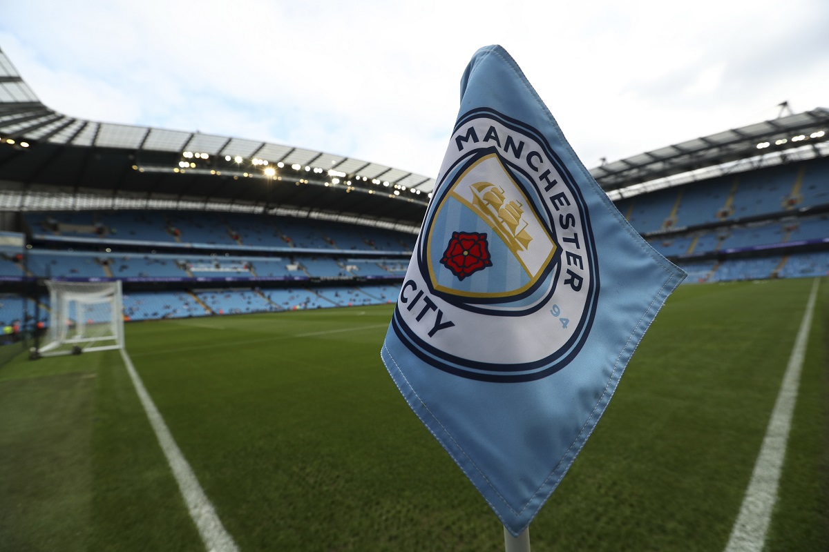 FILE - The club logo decorates a corner flag before the English Premier League soccer match between Manchester City and Newcastle United at the Etihad Stadium in Manchester, England, Saturday, Sept. 1, 2018. (AP Photo/Jon Super, File)