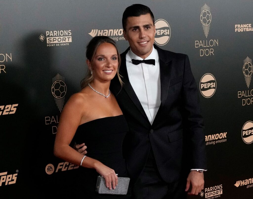 Spanish player Rodri, right, and his partner Laura Iglesias arrive for the 68th Ballon d'Or (Golden Ball) award ceremony at Theatre du Chatelet in Paris, Monday, Oct. 28, 2024. (AP Photo/Michel Euler)