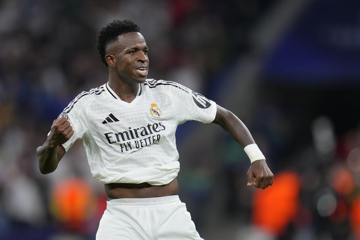 Real Madrid's Vinicius Junior celebrates after scoring his side's fourth goal during the Champions League opening phase soccer match between Real Madrid and Borussia Dortmund at the Santiago Bernabeu stadium in Madrid, Tuesday, Oct. 22, 2024. Real Madrid won 5-2. (AP Photo/Manu Fernandez)