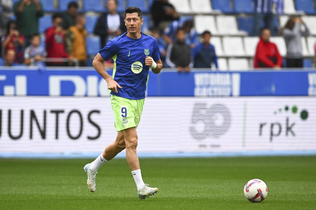 Barcelona's Robert Lewandowski warms-up prior to a Spanish La Liga soccer match against Alaves at the Mendizorroza stadium in Vitoria-Gasteiz, Spain, Sunday, Oct. 6, 2024. (AP Photo/Miguel Oses)