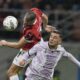 AC Milan's Strahinja Pavlovic, left, and Udinese's Lorenzo Lucca challenge for the ball during the Serie A soccer match between AC Milan and Udinese at the San Siro Stadium, in Milan, Italy, Saturday, Oct. 19, 2024. (AP Photo/Antonio Calanni)