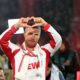 FC Köln's Lukas Podolski gestures to fans following his farewell soccer match, Thursday, Oct. 10, 2024, in Cologne, Germany. (Federico Gambarini/dpa via AP)