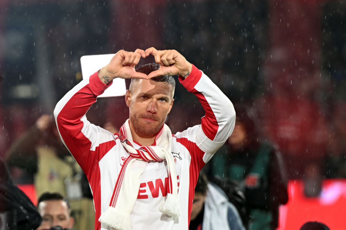 FC Köln's Lukas Podolski gestures to fans following his farewell soccer match, Thursday, Oct. 10, 2024, in Cologne, Germany. (Federico Gambarini/dpa via AP)