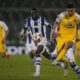 Maccabi Tel Aviv's Stav Lemkin passes the ball in front of Real Sociedad's Umar Sadiq during the Europa League opening phase soccer match between Maccabi Tel Aviv and Real Sociedad at the Partizan stadium in Belgrade, Serbia, Thursday, Oct. 24, 2024. (AP Photo/Darko Vojinovic)