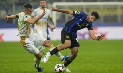 Inter Milan's Mehdi Taremi, right, duels for the ball with Red Star's Uros Spajic during the Champions League opening phase soccer match between Inter Milan and Red Star, at the San Siro stadium in Milan, Italy, Tuesday, Oct. 1, 2024. (AP Photo/Luca Bruno)