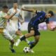 Inter Milan's Mehdi Taremi, right, duels for the ball with Red Star's Uros Spajic during the Champions League opening phase soccer match between Inter Milan and Red Star, at the San Siro stadium in Milan, Italy, Tuesday, Oct. 1, 2024. (AP Photo/Luca Bruno)