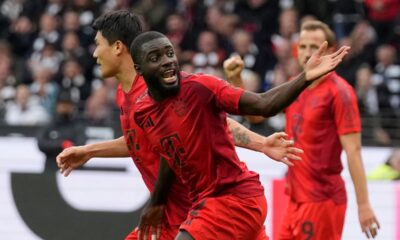 Bayern's Dayot Upamecano, centre, celebrates after scoring his side's second goal during the German Bundesliga soccer match between Eintracht Frankfurt and Bayern Munich in Frankfurt, Germany, Sunday, Oct. 6, 2024. (AP Photo/Michael Probst)