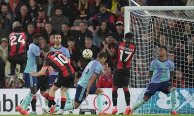 Bournemouth's Ryan Christie, centre, scores his side's opening goal during the English Premier League soccer match between Bournemouth and Arsenal at the Vitality Stadium in Bournemouth, England, Saturday, Oct. 19, 2024. (AP Photo/Kin Cheung)