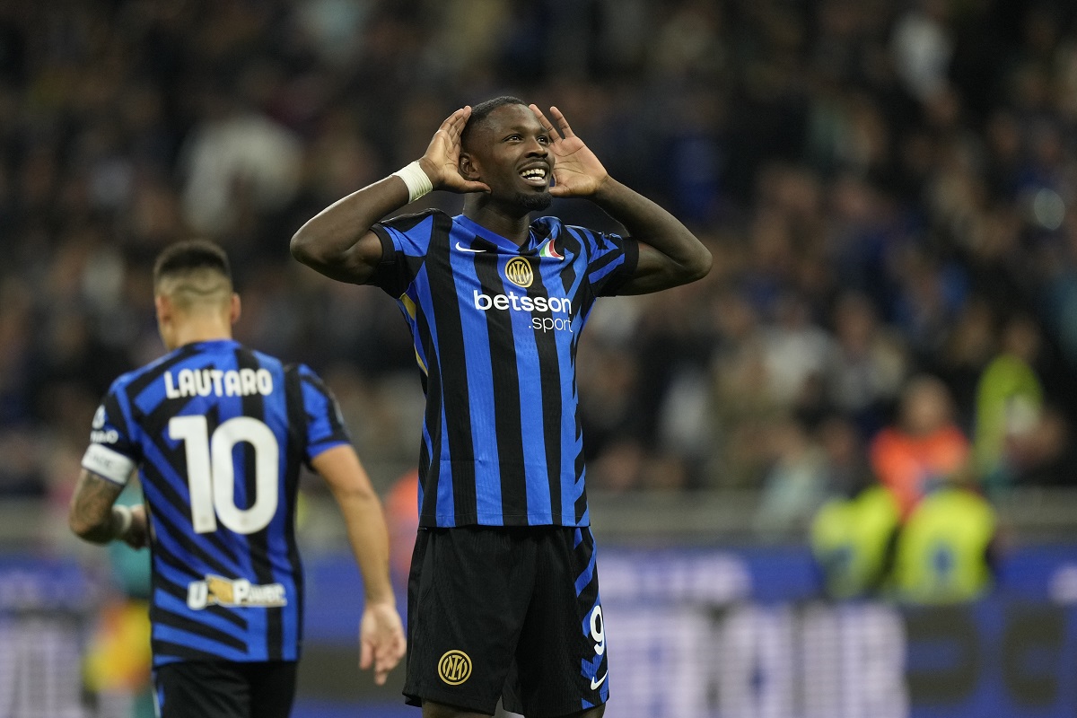 Inter Milan's Marcus Thuram celebrates scoring his side's 2nd goal during the Serie A soccer match between Inter Milan and Torino at the San Siro Stadium, in Milan, Italy, Saturday, Oct. 5, 2024. (AP Photo/Antonio Calanni)