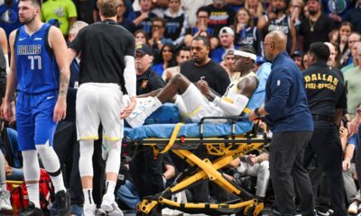 Utah Jazz forward Taylor Hendricks (0) is carried off by paramedics after sustaining an injury in the second half during an NBA basketball game against the Dallas Mavericks, Monday, Oct. 28, 2024, in Dallas. (AP Photo/Albert Pena)