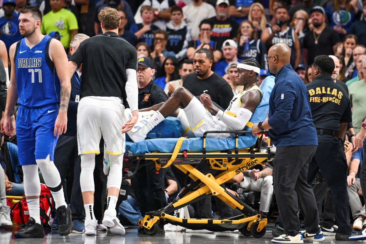 Utah Jazz forward Taylor Hendricks (0) is carried off by paramedics after sustaining an injury in the second half during an NBA basketball game against the Dallas Mavericks, Monday, Oct. 28, 2024, in Dallas. (AP Photo/Albert Pena)