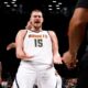 Denver Nuggets' Nikola Jokic (15), of Serbia, reacts to a call during the third quarter of an NBA basketball game against the Brooklyn Nets, Tuesday, Oct. 29, 2024, in New York. (AP Photo/Jason DeCrow)