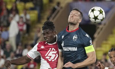 Monaco's Breel Embolo, left, and Red Star's Uros Spajic jump for the ball during the Champions League opening phase soccer match between Monaco and Crvena Zvezda, Red Star Belgrade, at the Louis II stadium, in Monaco, Tuesday, Oct. 22, 2024. (AP Photo/Laurent Cipriani)