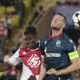 Monaco's Breel Embolo, left, and Red Star's Uros Spajic jump for the ball during the Champions League opening phase soccer match between Monaco and Crvena Zvezda, Red Star Belgrade, at the Louis II stadium, in Monaco, Tuesday, Oct. 22, 2024. (AP Photo/Laurent Cipriani)