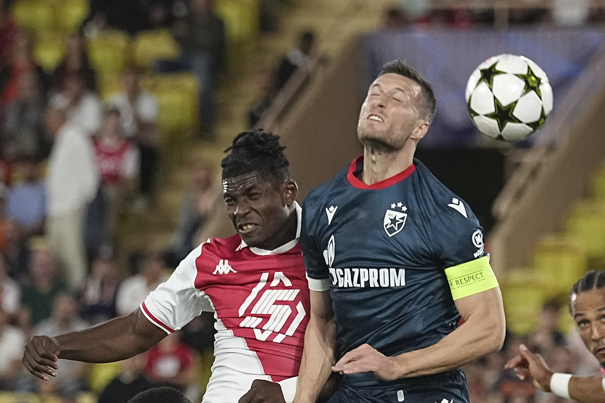 Monaco's Breel Embolo, left, and Red Star's Uros Spajic jump for the ball during the Champions League opening phase soccer match between Monaco and Crvena Zvezda, Red Star Belgrade, at the Louis II stadium, in Monaco, Tuesday, Oct. 22, 2024. (AP Photo/Laurent Cipriani)