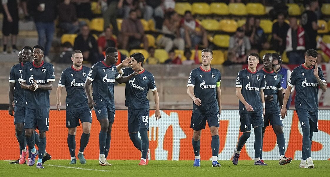 Red Star's players celebrate a goal from they teammate Cherif Ndiaye after scoring against Monaco during the Champions League opening phase soccer match between Monaco and Crvena Zvezda, Red Star Belgrade, at the Louis II stadium, in Monaco, Tuesday, Oct. 22, 2024. (AP Photo/Laurent Cipriani)