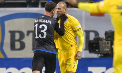 Kosovo's Amir Rrahmani, left, argues with Romania's Denis Alibec during the UEFA Nations League soccer match between Romania and Kosovo at the National Arena stadium in Bucharest, Romania, Saturday, Nov. 16, 2024. (AP Photo/Alexandru Dobre)