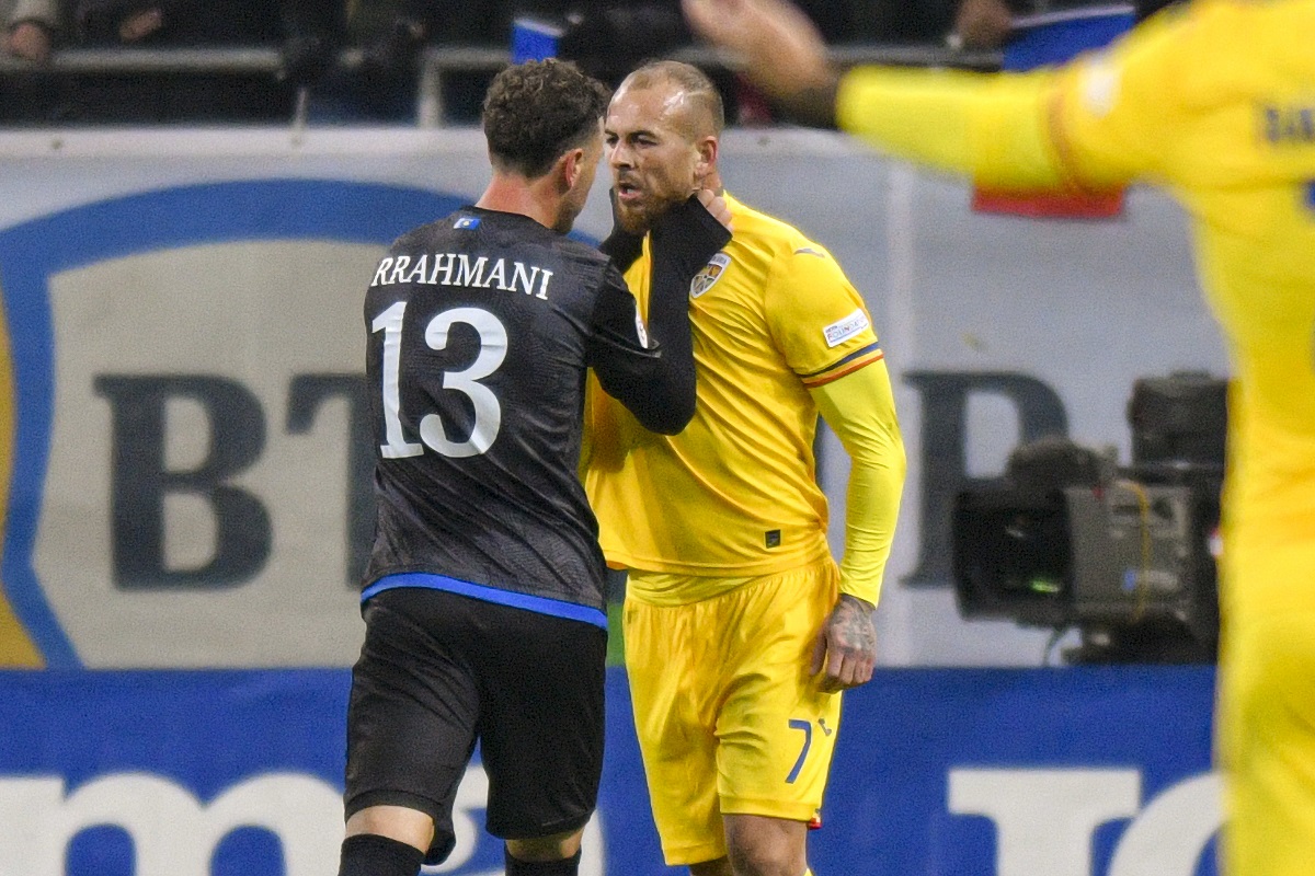 Kosovo's Amir Rrahmani, left, argues with Romania's Denis Alibec during the UEFA Nations League soccer match between Romania and Kosovo at the National Arena stadium in Bucharest, Romania, Saturday, Nov. 16, 2024. (AP Photo/Alexandru Dobre)