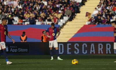 Barcelona's players react after the second goal of Las Palmas during a Spanish La Liga soccer match at the Lluis Companys Olympic Stadium in Barcelona, Spain, Saturday Nov. 30, 2024. (AP Photo/Joan Monfort)