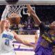 Orlando Magic center Moritz Wagner, left, dunks as Los Angeles Lakers center Christian Koloko defends during the first half of an NBA basketball game, Thursday, Nov. 21, 2024, in Los Angeles. (AP Photo/Mark J. Terrill)