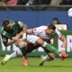 Werder's Marco Friedl, left, vies for the ball with Stuttgart's Ermedin Demirovic , during a German Bundesliga soccer match between Werder Bremen and VfB Stuttgart, in Bremen, Germany, Saturday, Nov. 30, 2024. (Carmen Jaspersen/dpa via AP)