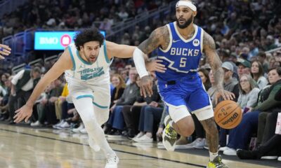 Milwaukee Bucks' Gary Trent Jr. gets past Charlotte Hornets' Vasilije Micic during the second half of an NBA basketball game Saturday, Nov. 23, 2024, in Milwaukee. The Bucks won 125-119. (AP Photo/Morry Gash)