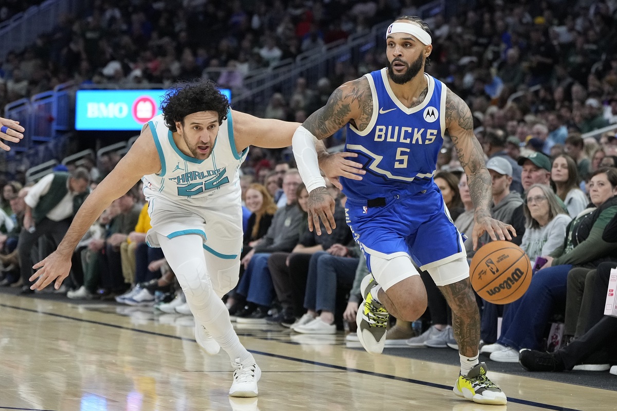 Milwaukee Bucks' Gary Trent Jr. gets past Charlotte Hornets' Vasilije Micic during the second half of an NBA basketball game Saturday, Nov. 23, 2024, in Milwaukee. The Bucks won 125-119. (AP Photo/Morry Gash)