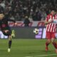 Barcelona's Robert Lewandowski shoots by Red Star's Seol Young-woo during the Champions League opening phase soccer match between Red Star and Barcelona at the Rajko Mitic Stadium in Belgrade, Serbia, Wednesday, Nov. 6, 2024. (AP Photo/Darko Vojinovic)