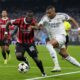 Real Madrid's Kylian Mbappe, right, and AC Milan's Yunus Musah battle for the ball during the Champions League opening phase soccer match at the Santiago Bernabeu stadium in Madrid, Spain, Tuesday, Nov. 5, 2024. (AP Photo/Manu Fernandez)