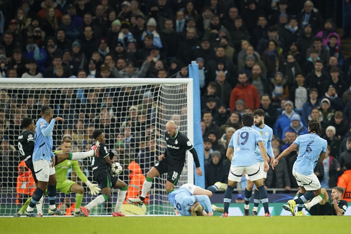 The incident that led to Manchester City's penalty during the Champions League opening phase soccer match between Manchester City and Feyenoord at the Etihad Stadium in Manchester, England, Tuesday, Nov. 26, 2024. (AP Photo/Dave Thompson)