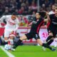 Stuttgart's Enzo Millot, left, in action against Frankfurt's Arthur Theate during the Bundesliga soccer match between VfB Stuttgart - Eintracht Frankfurt, at the MHPArena in Stuttgart, Germany, Sunday Nov. 10, 2024. (Tom Weller/dpa via AP)